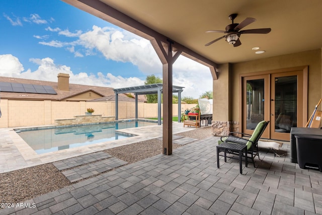 view of pool with a pergola, ceiling fan, and a patio