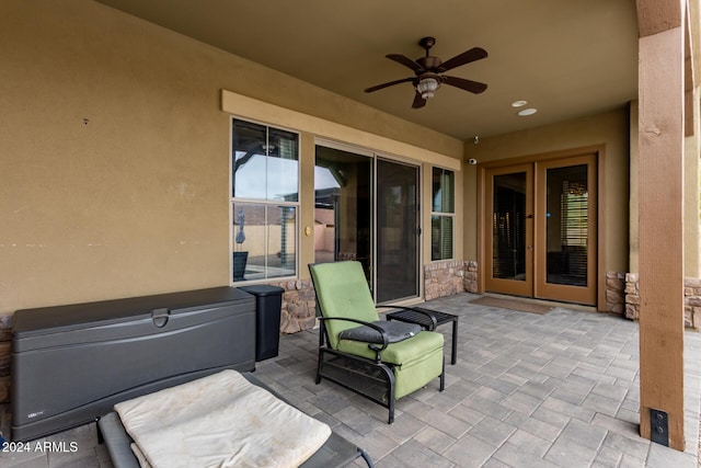 view of patio with ceiling fan and french doors