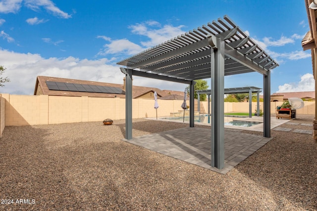 view of yard featuring a pergola, a fenced in pool, and a patio area