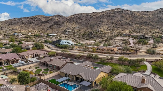 birds eye view of property with a mountain view