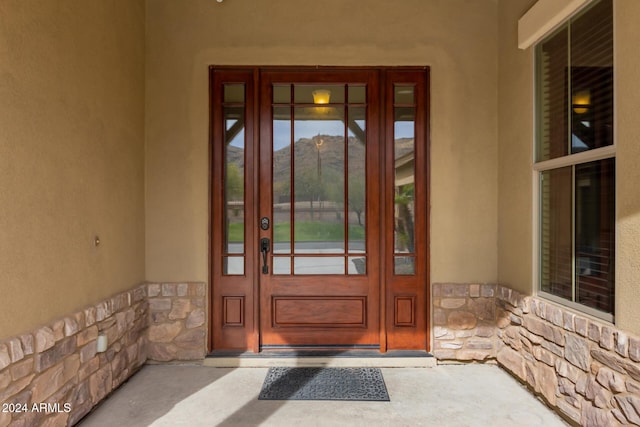 property entrance with a mountain view