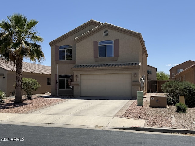 42775 W Jeremy St, Maricopa, AZ 85138 - view of front facade featuring a tiled roof, fence, concrete driveway, an attached garage, and stucco siding