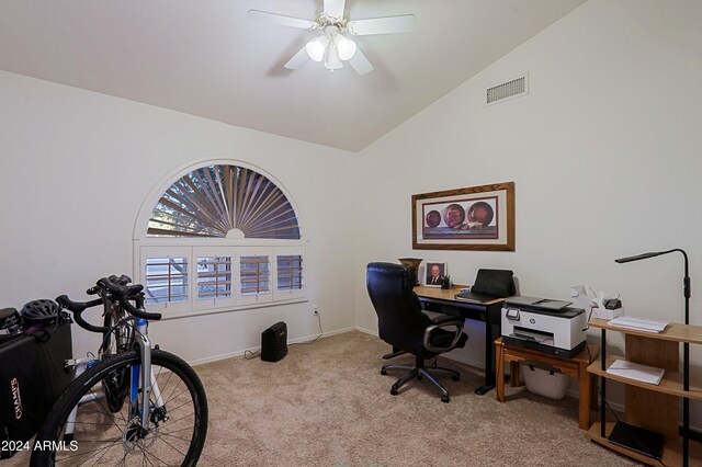 office area with ceiling fan, light colored carpet, and vaulted ceiling