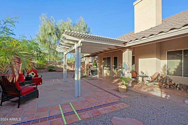 view of patio featuring a pergola and a grill