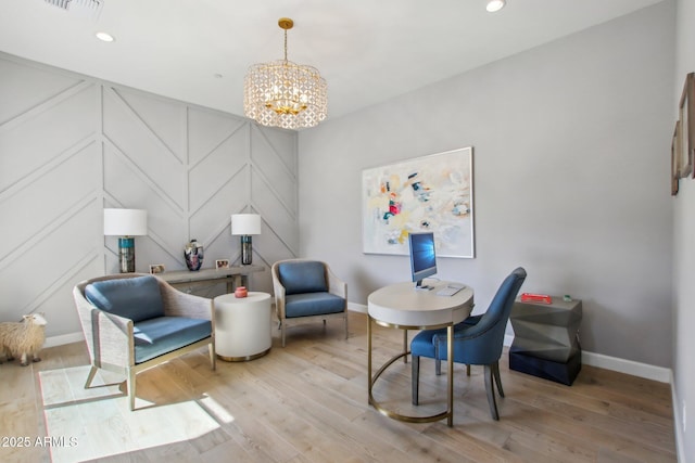 living area with an inviting chandelier, recessed lighting, wood finished floors, and baseboards