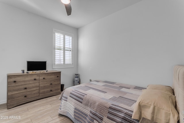 bedroom with light wood-type flooring and ceiling fan