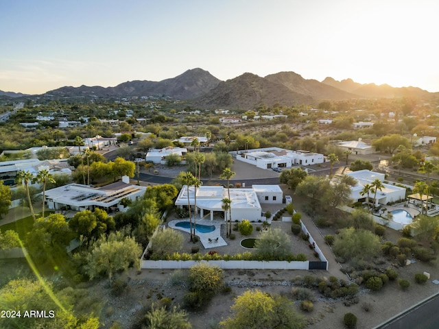 birds eye view of property featuring a mountain view