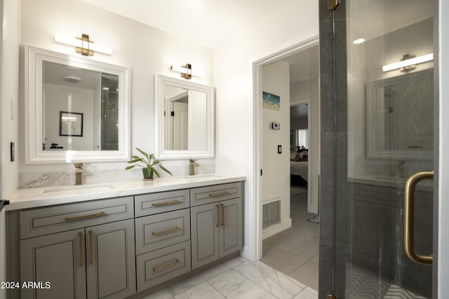 bathroom featuring vanity and an enclosed shower