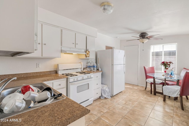 kitchen with white appliances, ceiling fan, white cabinets, range hood, and light tile patterned floors