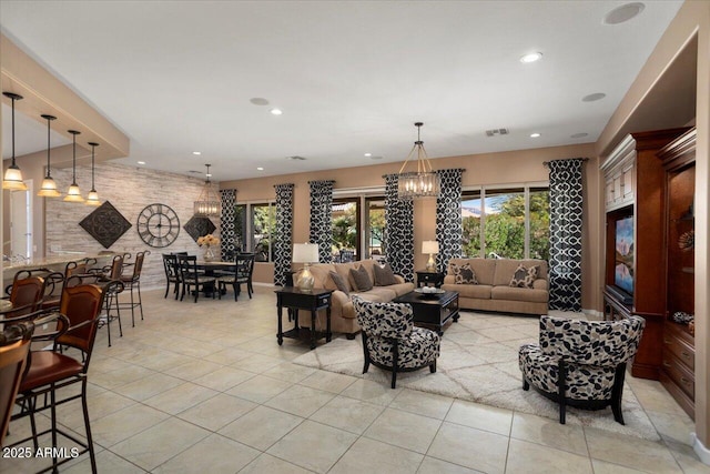 living room featuring light tile patterned floors and a chandelier