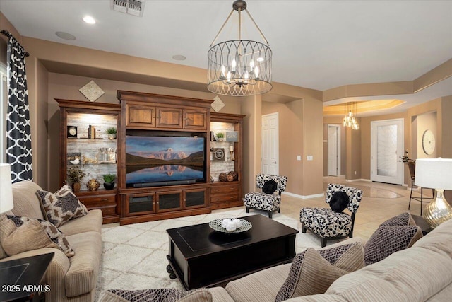 tiled living room featuring a notable chandelier