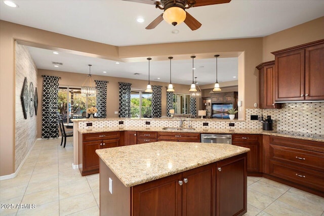 kitchen with pendant lighting, a kitchen island, decorative backsplash, stainless steel dishwasher, and kitchen peninsula