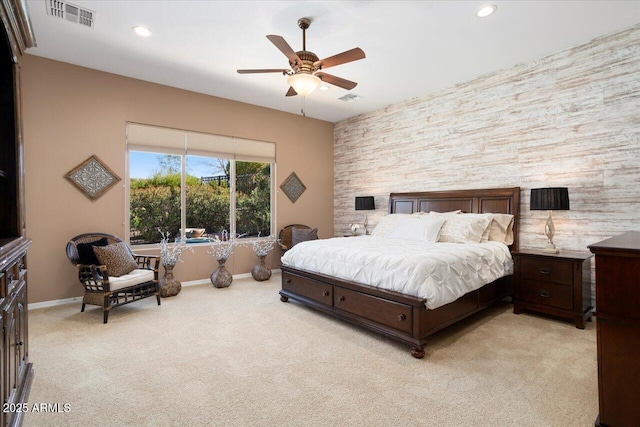 bedroom with ceiling fan and light carpet