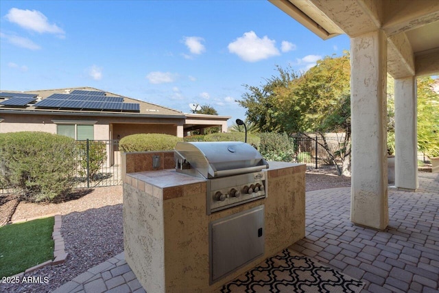 view of patio featuring a grill and exterior kitchen