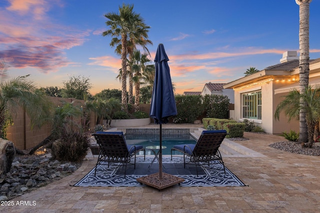 5122 S Miller Pl, Chandler, AZ 85249 - patio terrace at dusk with a fenced backyard and a fenced in pool