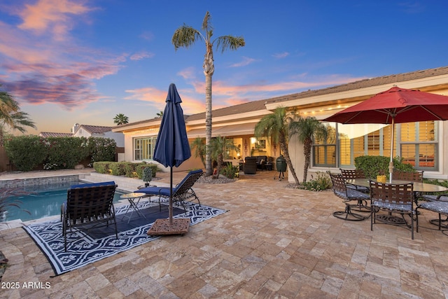 5122 S Miller Pl, Chandler, AZ 85249 - view of patio featuring outdoor dining space and an outdoor pool