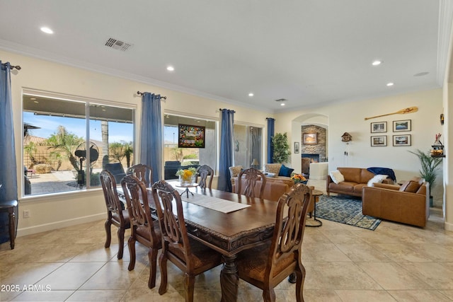 5122 S Miller Pl, Chandler, AZ 85249 - dining space with visible vents, ornamental molding, arched walkways, and recessed lighting