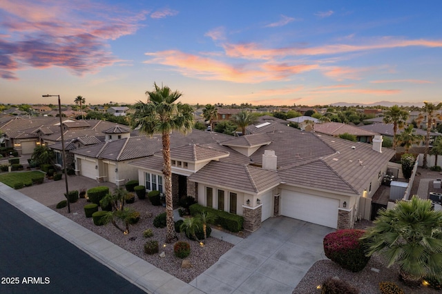 5122 S Miller Pl, Chandler, AZ 85249 - view of front of house featuring a residential view, driveway, stone siding, and an attached garage