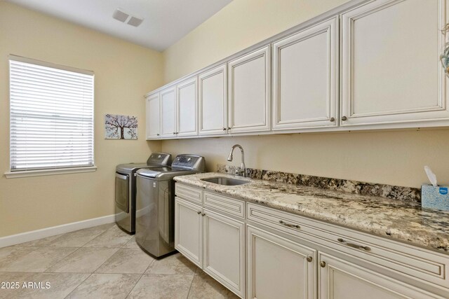 5122 S Miller Pl, Chandler, AZ 85249 - washroom with separate washer and dryer, cabinet space, a sink, baseboards, and visible vents