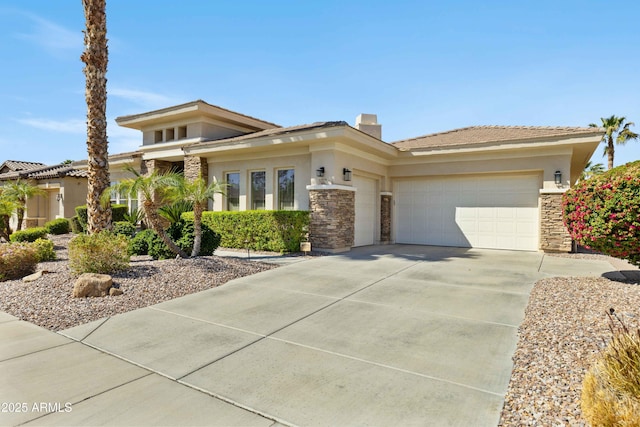 5122 S Miller Pl, Chandler, AZ 85249 - prairie-style house featuring concrete driveway, stone siding, a chimney, an attached garage, and stucco siding
