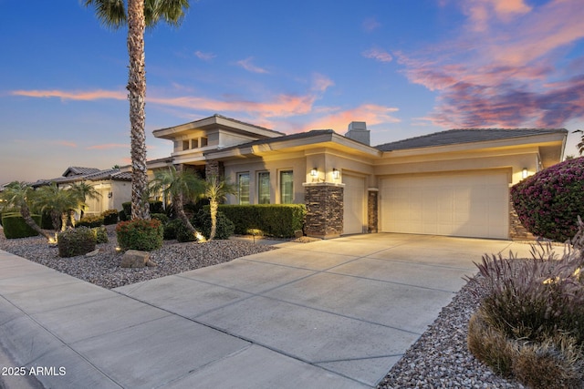 5122 S Miller Pl, Chandler, AZ 85249 - prairie-style house featuring concrete driveway, stone siding, a chimney, stucco siding, and a garage