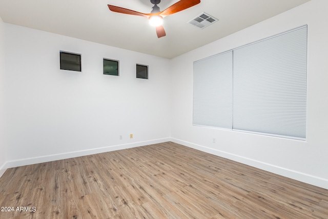 unfurnished room featuring ceiling fan and light hardwood / wood-style floors