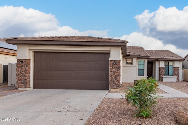 view of front of property with a garage