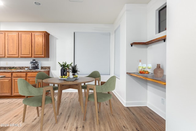 dining area featuring light wood-type flooring