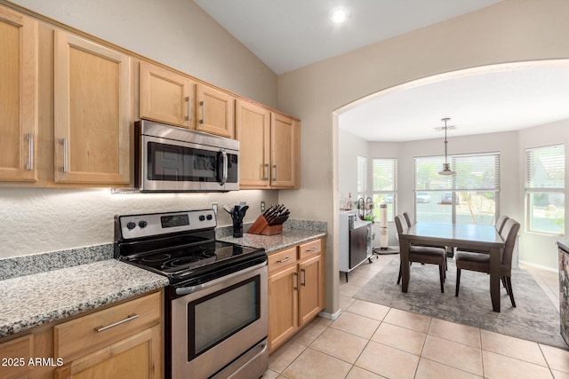 1634 E Harwell Rd, Phoenix, AZ 85042 - kitchen with appliances with stainless steel finishes, light brown cabinets, arched walkways, and light stone countertops