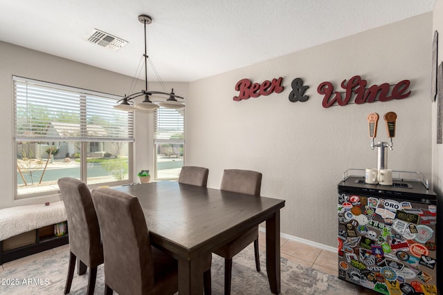 1634 E Harwell Rd, Phoenix, AZ 85042 - dining space with light tile patterned floors and baseboards