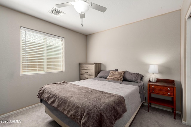 1634 E Harwell Rd, Phoenix, AZ 85042 - bedroom with light colored carpet, baseboards, and a ceiling fan