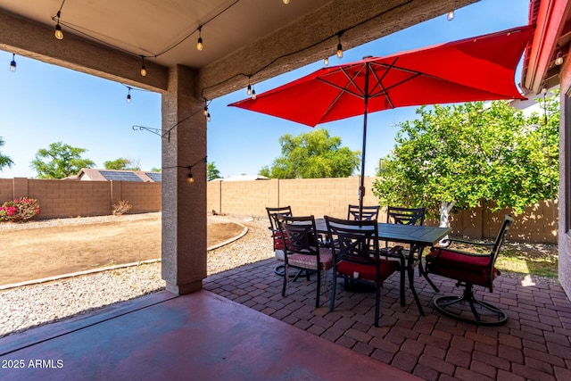 1634 E Harwell Rd, Phoenix, AZ 85042 - fenced backyard with outdoor dining space and a patio