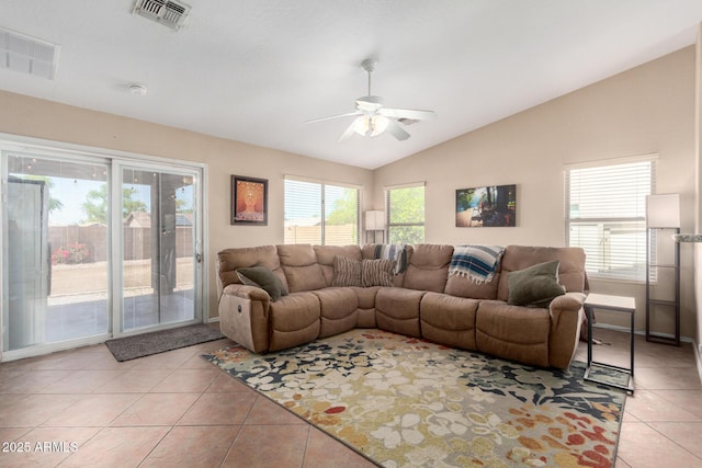 1634 E Harwell Rd, Phoenix, AZ 85042 - living area featuring light tile patterned flooring, vaulted ceiling, and ceiling fan