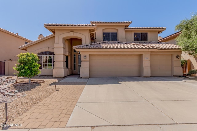 5215 W Del Rio St, Chandler, AZ 85226 - mediterranean / spanish-style house featuring a tiled roof, concrete driveway, and stucco siding