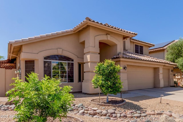 5215 W Del Rio St, Chandler, AZ 85226 - mediterranean / spanish house featuring concrete driveway, a tiled roof, a garage, and stucco siding
