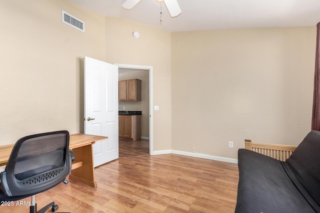 5215 W Del Rio St, Chandler, AZ 85226 - office featuring visible vents, baseboards, ceiling fan, vaulted ceiling, and light wood-style flooring