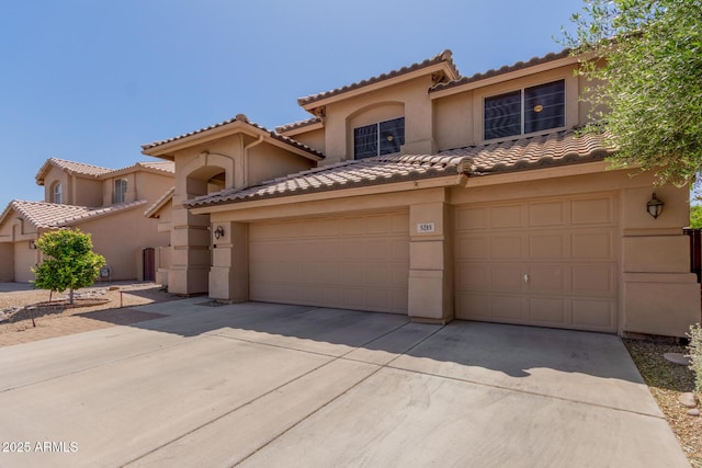 5215 W Del Rio St, Chandler, AZ 85226 - mediterranean / spanish house featuring a tiled roof, concrete driveway, stucco siding, and a garage