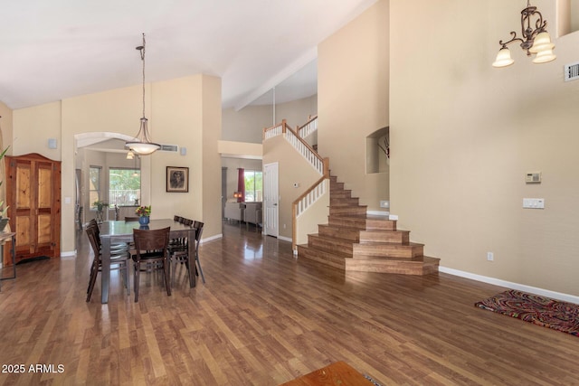 5215 W Del Rio St, Chandler, AZ 85226 - dining area with arched walkways, wood finished floors, a high ceiling, and plenty of natural light