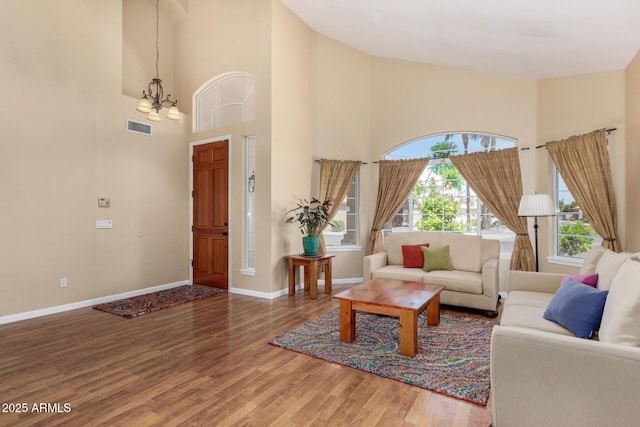 5215 W Del Rio St, Chandler, AZ 85226 - living area featuring visible vents, baseboards, a notable chandelier, and wood finished floors