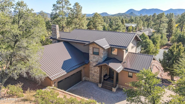 birds eye view of property featuring a mountain view