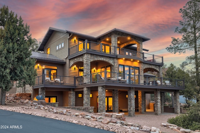 view of front of house featuring a balcony