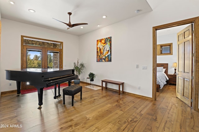 misc room with ceiling fan and hardwood / wood-style flooring