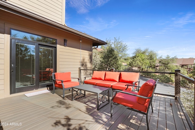 wooden deck featuring outdoor lounge area