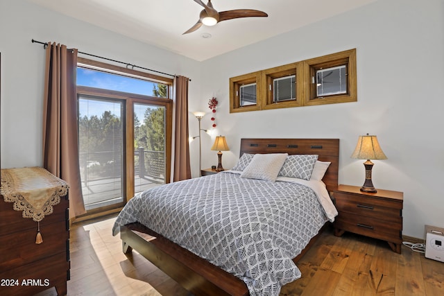 bedroom with hardwood / wood-style floors, access to outside, and ceiling fan