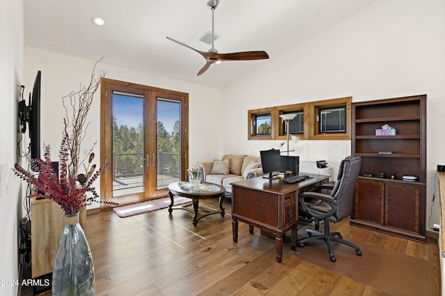 office space featuring vaulted ceiling, ceiling fan, wood-type flooring, and french doors