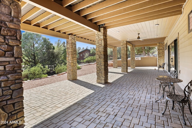 view of patio / terrace featuring ceiling fan and exterior kitchen