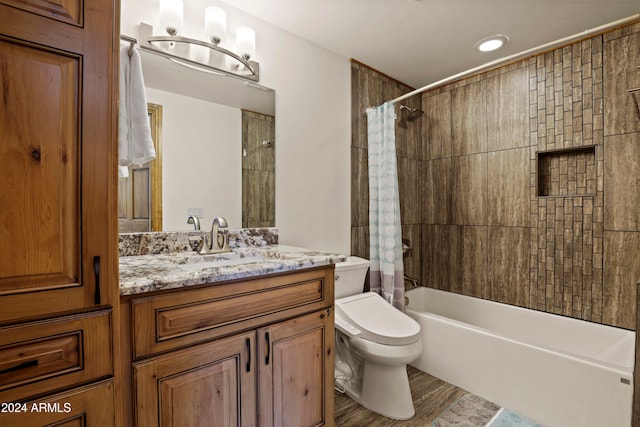 full bathroom with vanity, shower / tub combo, toilet, and hardwood / wood-style flooring