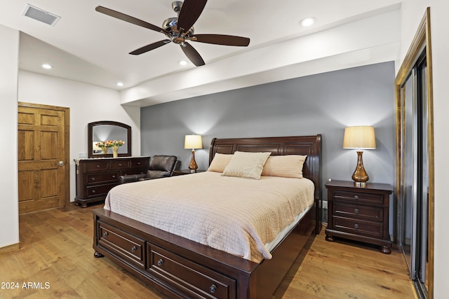 bedroom featuring ceiling fan and light hardwood / wood-style floors