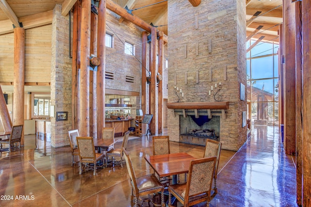 dining space with beamed ceiling, high vaulted ceiling, and wooden ceiling