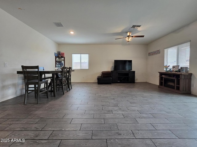 dining space featuring plenty of natural light and ceiling fan